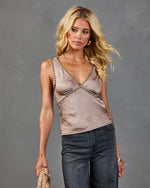 Satin studded cami tank top in taupe with gold beaded trim detail, styled with dark gray jeans on blonde female model