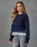 Navy blue cropped knit sweater with satin and white lace hem trim, worn with gray jeans, women's layered fashion top