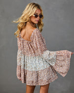 Boho floral mini dress with bell sleeves, open back, tiered skirt in blush pink and sage patchwork print