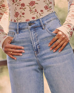 Logan Super Stretch High Rise Relaxed Raw Hem Jeans