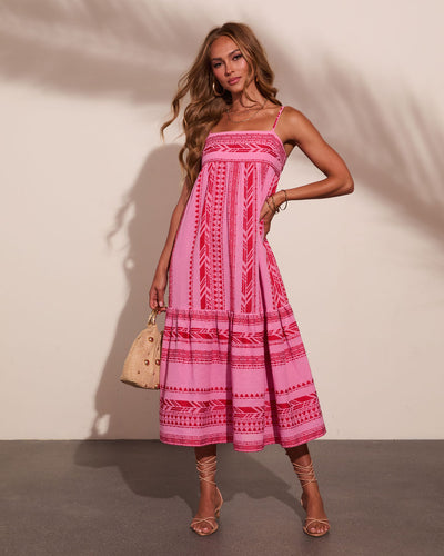 artisanal pink midi dress The Saylor Dress in hot pink is a stunning midi that radiates confidence  and charm. This woven piece features delicate embroidery that adds artisanal  appeal, while refined pintuck details at the neckline