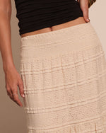Cream lace tiered midi skirt with smocked waistband styled with black ruched crop top