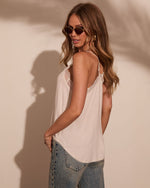 White lace-trim cami top styled with blue jeans on woman with sunglasses, boho summer fashion flatlay