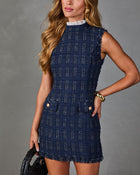 Navy blue tweed mini dress with lace collar, gold buttons, fringe hem, worn with gold cuff bracelet and woven black bag