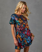 Multicolor sequin floral mini dress with short sleeves on blonde model, festive party style