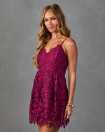 Magenta floral lace mini dress with spaghetti straps and scalloped hem on blonde female model