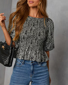 Crestal Puff Sleeve Peplum Top