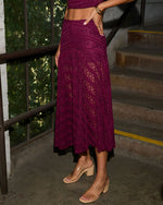 Burgundy lace midi skirt with floral crochet pattern, paired with nude block heel sandals and gold bracelets