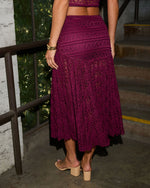 Burgundy lace midi skirt with floral pattern, A-line silhouette, paired with beige block heel mules, back view