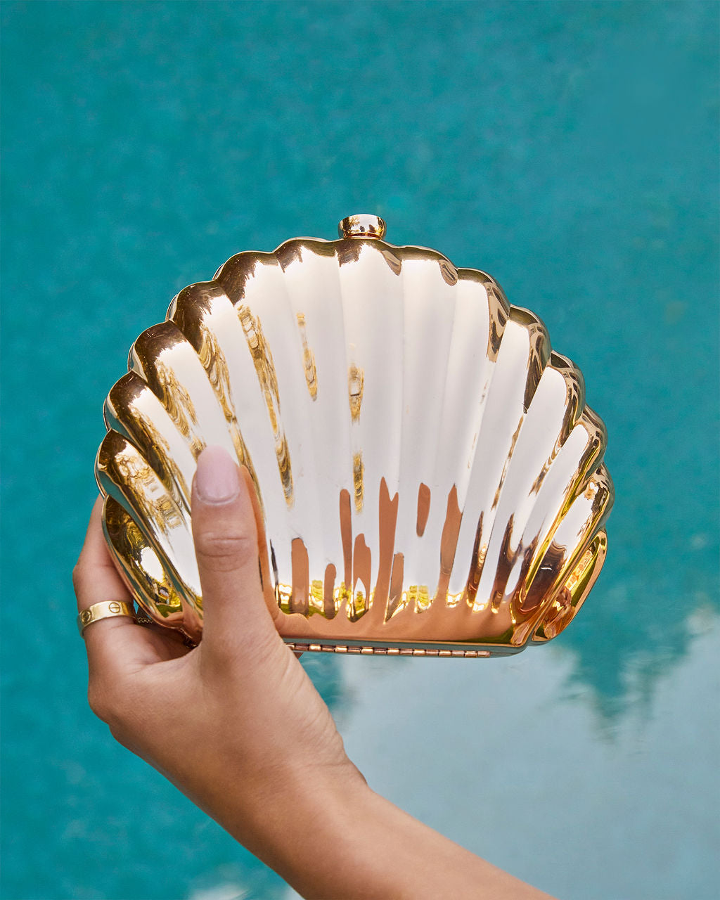 Gold shell clutch on sale