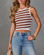 Women's white and rust brown striped cropped knit tank top styled with light wash jeans and gold accessories