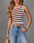 Women's white and rust brown striped cropped knit tank top styled with light wash jeans and gold accessories