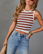 Women's brown and white striped ribbed knit crop tank top paired with light wash high-waist jeans
