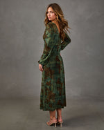 Green velvet midi dress with brown floral print, long balloon sleeves and open back, styled with nude heeled sandals