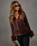 Brown wool cardigan with faux fur trim on hem and cuffs, styled with black pants, cat-eye sunglasses and a brown handbag
