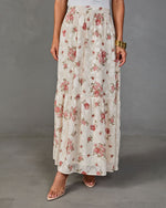 Cream floral maxi skirt with pink roses, tiered silhouette, elastic waist, styled with white top and clear heels