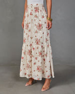 Cream floral maxi skirt with pink roses, tiered ruffle hem, elastic waist, styled with clear heeled sandals