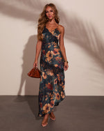 Floral satin maxi slip dress with black lace trim, V-neckline, worn with strappy heels and cognac bag