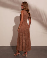 Brown lace midi dress with flared skirt, worn with nude heeled sandals and gold bracelets, back view