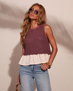 Women's mauve knit crochet tank top with cream ruffle hem, paired with light wash jeans and gold accessories