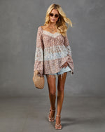 Boho floral tiered blouse with lace trim, bell sleeves, denim cutoff shorts, strappy heels, woven bag, blonde model