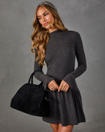 Charcoal gray long-sleeve mini dress with drop waist and flared cuffs, styled with a black suede handbag and herringbone headband