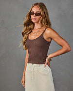 Woman wearing brown ribbed tank top with scoop neck and cream corduroy wide-leg pants, styled with gold jewelry and cat-eye sunglasses