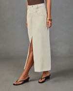 Cream corduroy maxi skirt with front slit, worn with brown bodysuit and black wedge flip flops