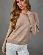 Women's taupe knit sweater with whipstitch detail, boat neckline, balloon sleeves, paired with white jeans
