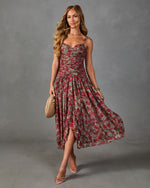 Floral ruched midi dress in sage green and red rose print with sweetheart neckline, flowing skirt, worn with clear heels