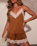 Brown suede lace-trim cami top and shorts set on model, cream floral lace detail, gold accessories, beige clutch