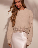 Beige ribbed knit crop sweater with floral lace hem, paired with satin midi skirt on female model